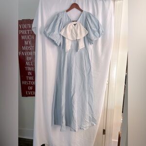 Ice blue mid length dress with bow accent
